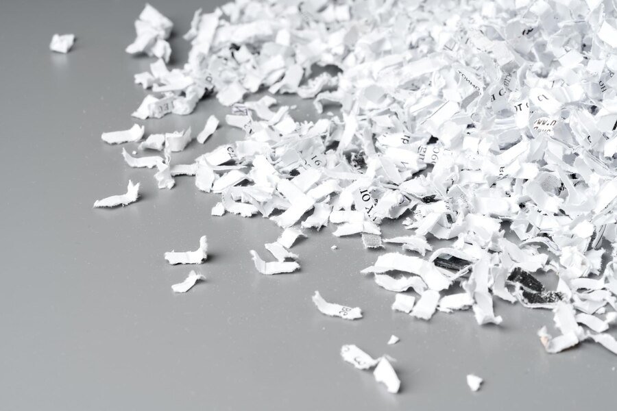 shredded-paper-white-background-close-up_93675-161213